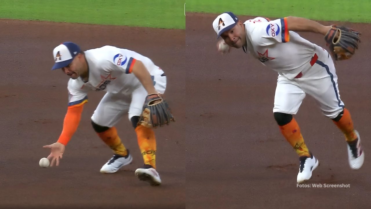 Jose Altuve tomando la pelota a mano limpia con Houston Astros